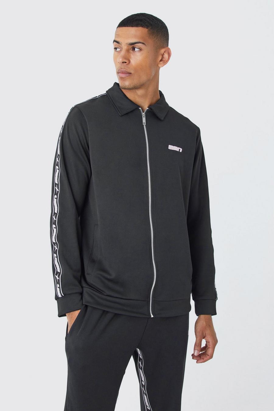 Tuta sportiva in tricot con striscia Man e zip, Black image number 1
