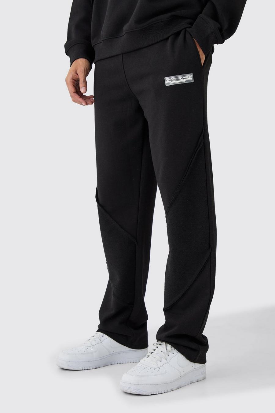 Pantalón deportivo holgado con panel y bajo sin acabar, Black image number 1