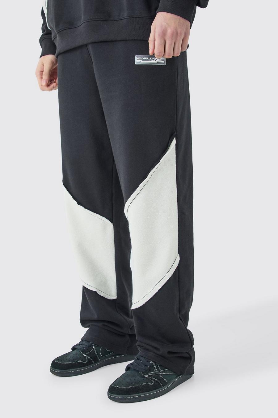 Pantalón deportivo Tall holgado con panel y bajo sin acabar, Black image number 1