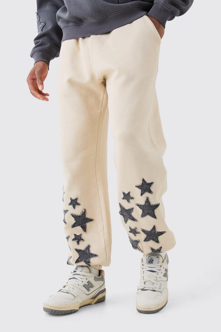 Pantalón deportivo recto vaquero con lavado de ácido y aplique de estrellas, Stone