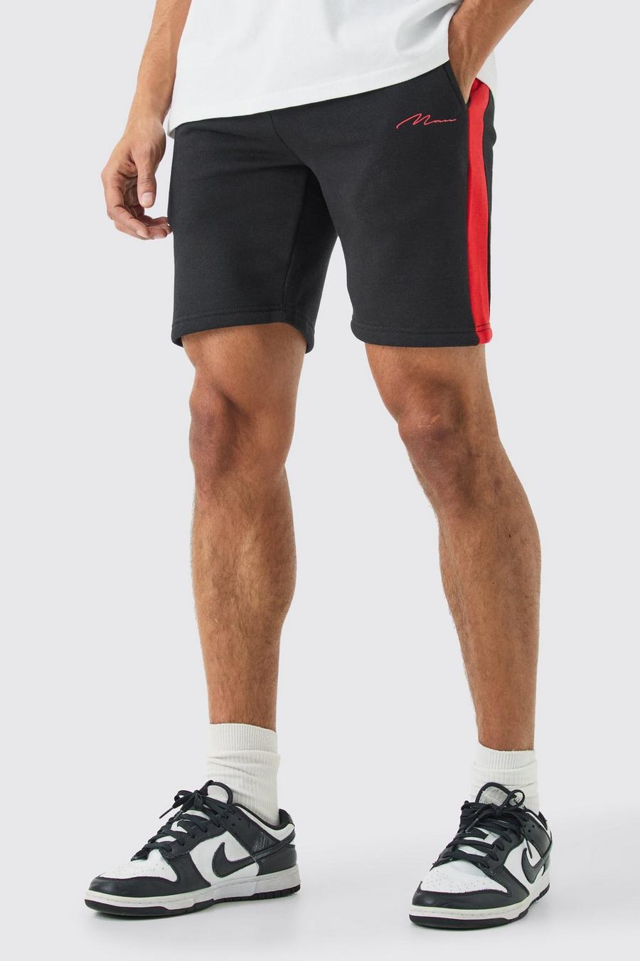 Black Man Signature Mellanlånga shorts i slim fit med blockfärger image number 1