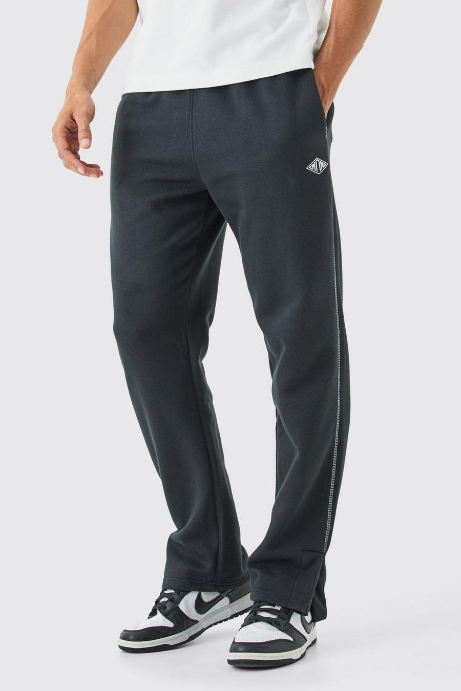 Pantalón deportivo MAN Regular con abertura en el bajo y costuras en contraste, Black image number 1