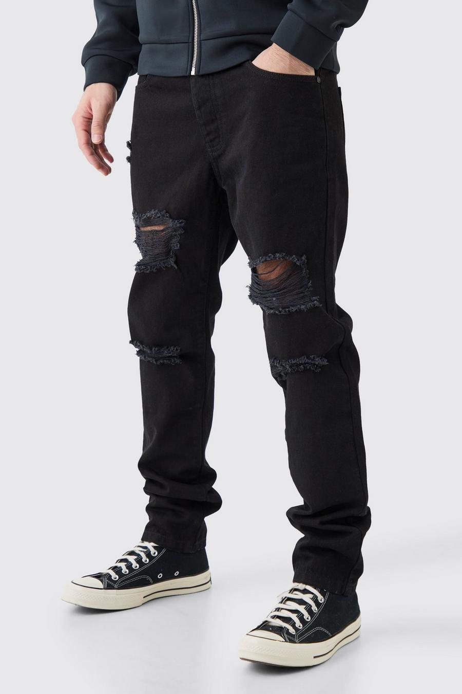 Jeans Slim Fit in True Black in denim rigido con strappi all over image number 1
