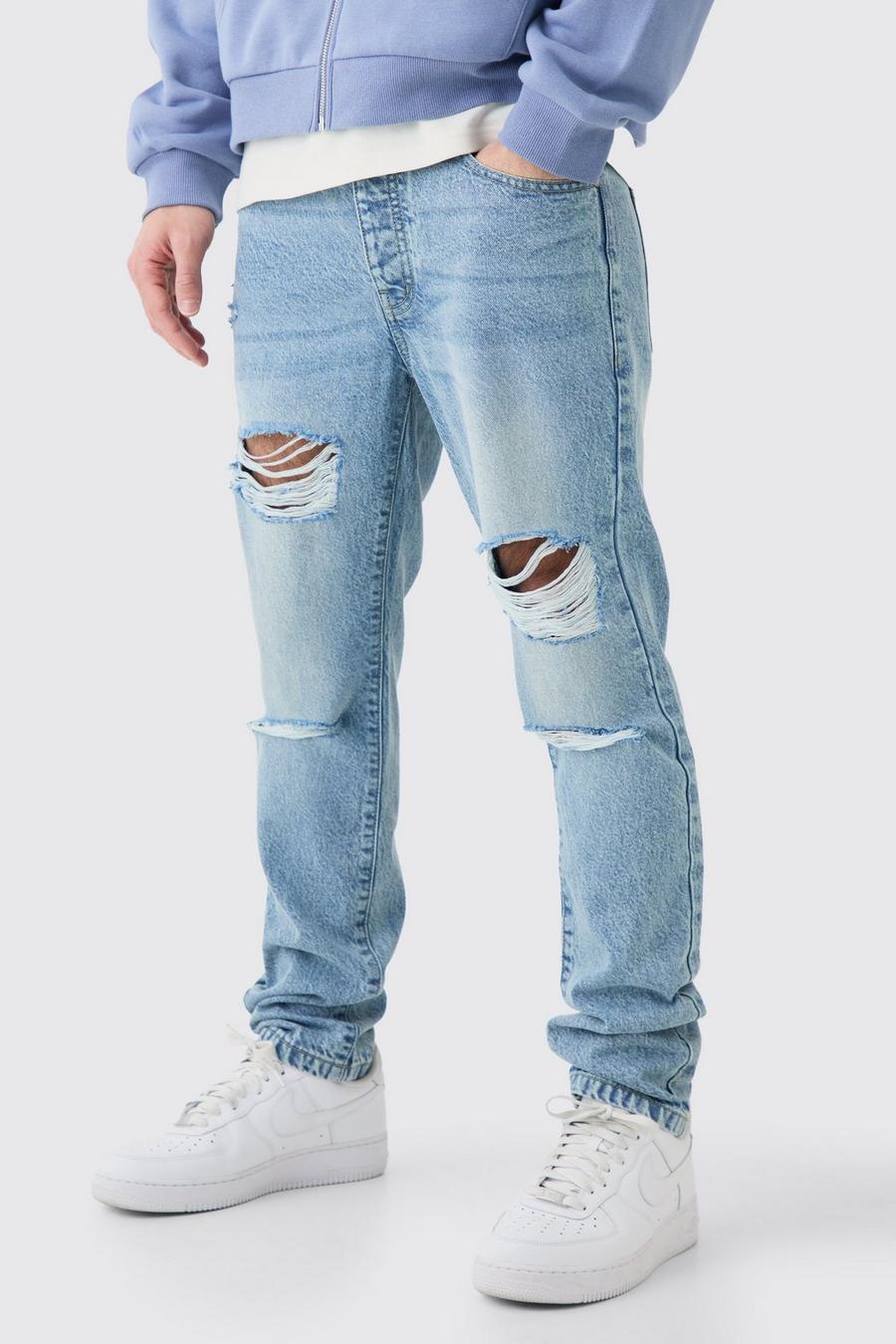 Jeans Slim Fit in denim rigido azzurro con strappi all over, Light blue