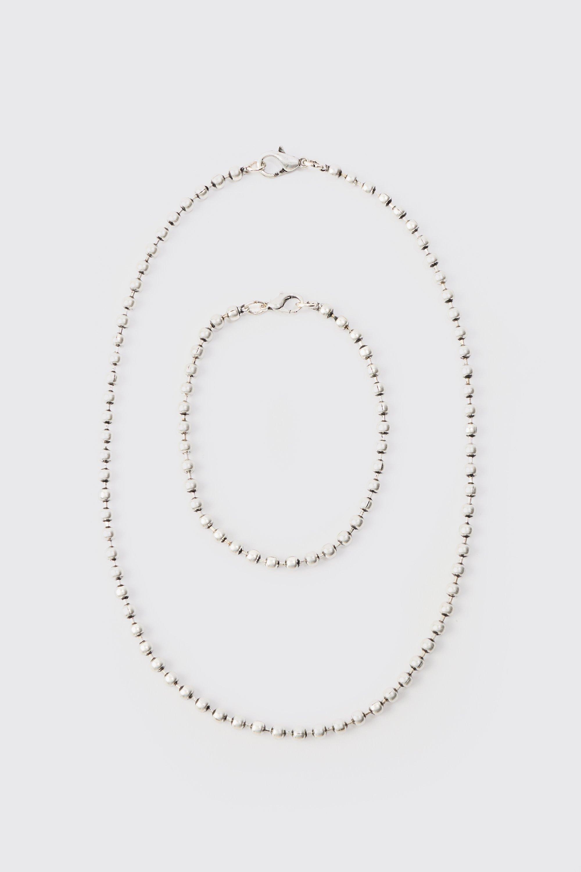 Collier métallisé à perles et bracelet