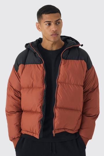 Boxy Curved Quilted Color Block Hooded Puffer In Rust rust