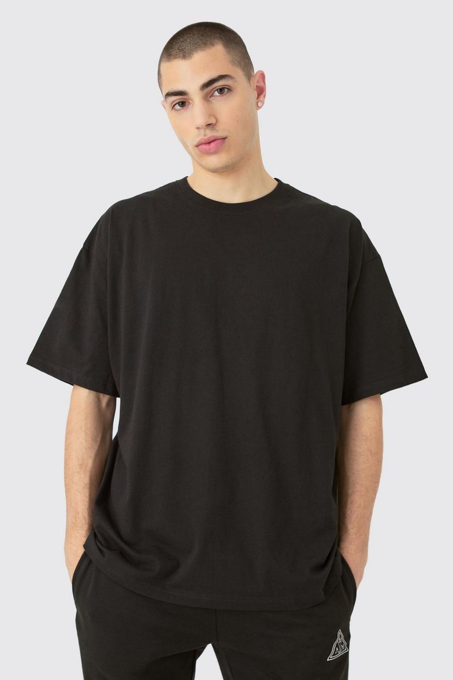 Camiseta básica oversize con cuello de caja, Black image number 1