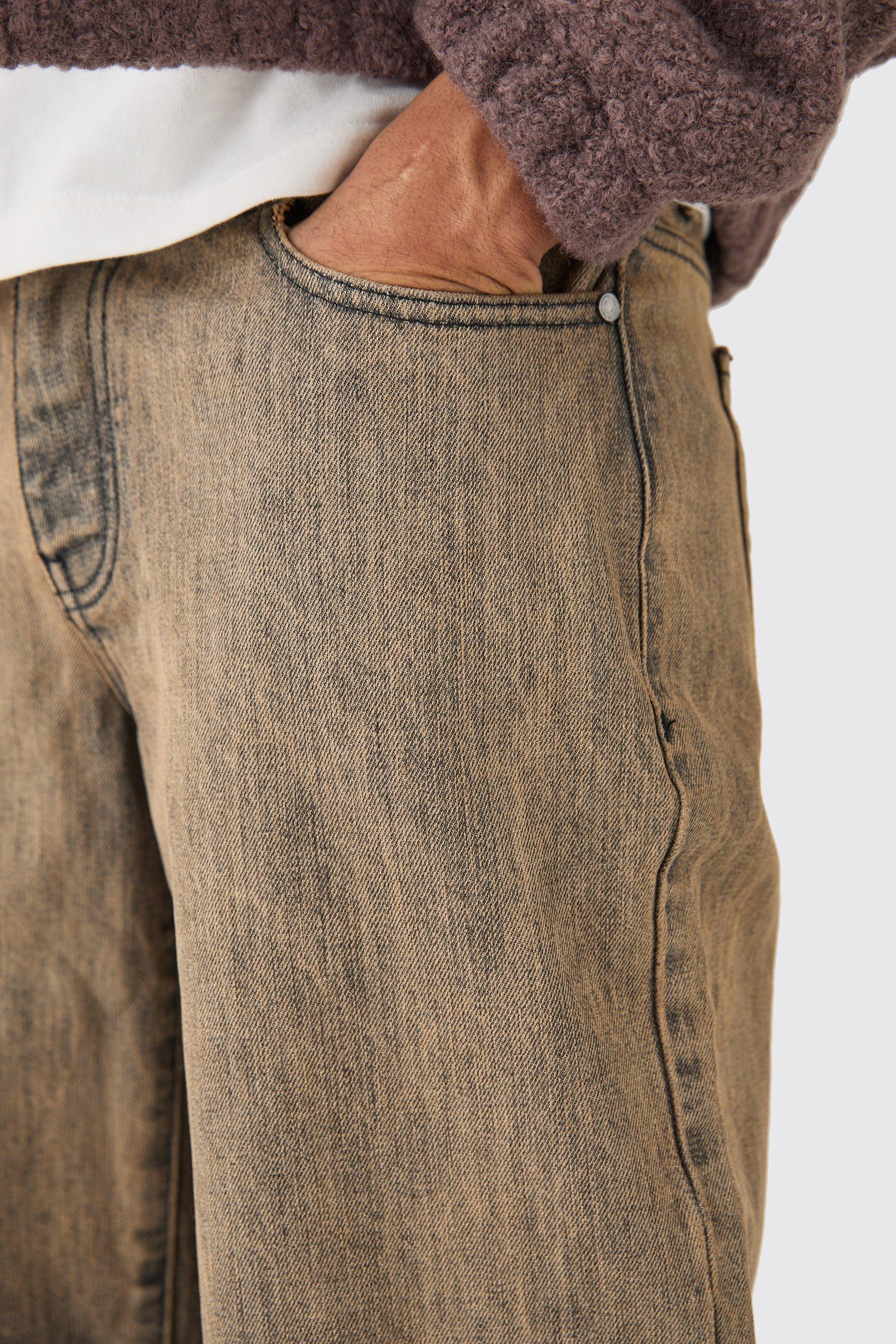 Jeans extra comodi marroni in denim rigido con strappi sul ginocchio