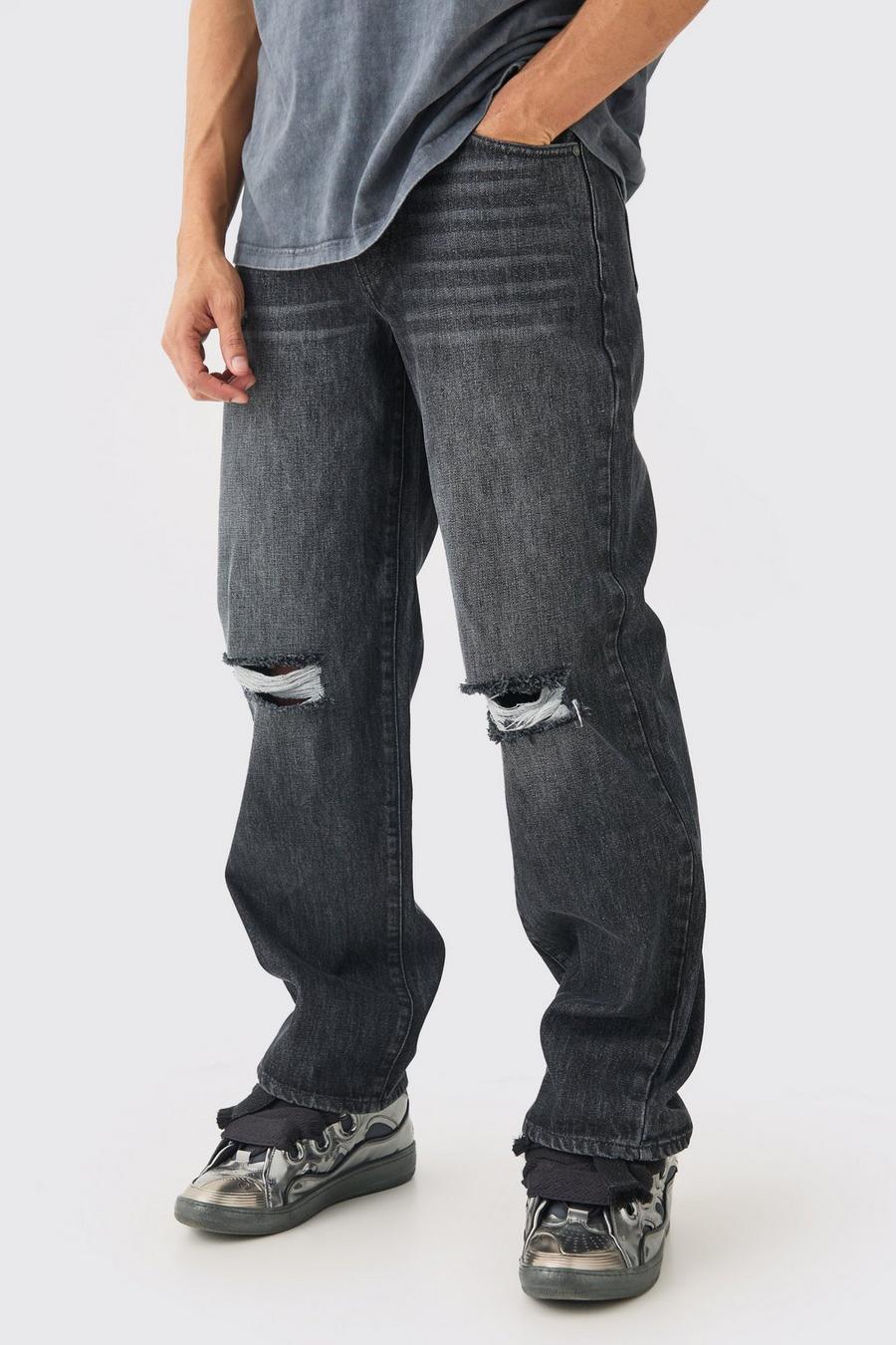 Jeans extra comodi in lavaggio nero in denim rigido con strappi sul ginocchio, Black image number 1
