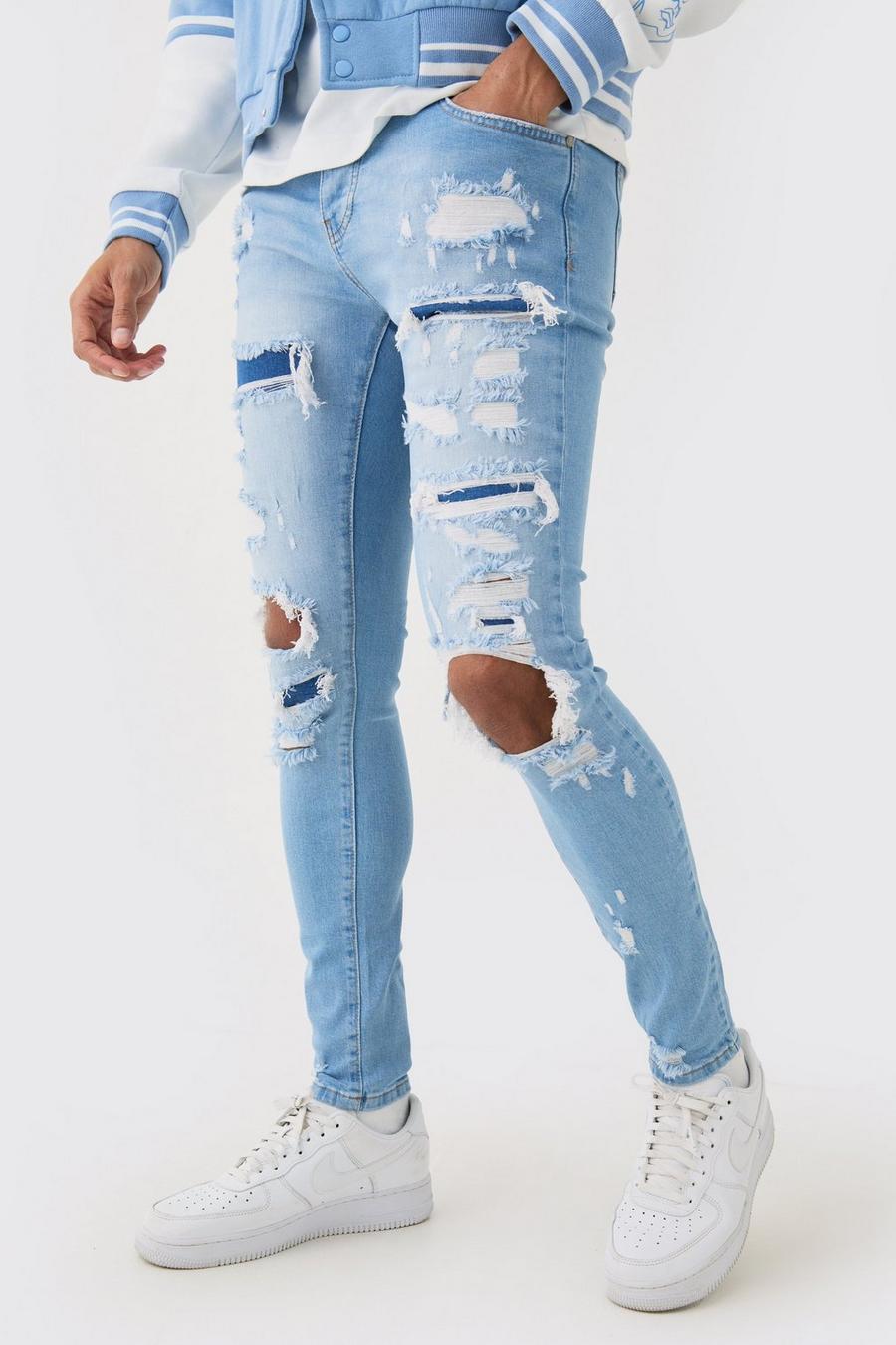 Jeans Skinny Fit in denim Stretch candeggiati con strappi all over azzurri, Light blue image number 1