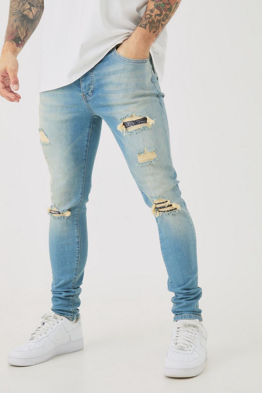 Light blue Ljusblå skinny jeans med slitna bandanamönster image number 1