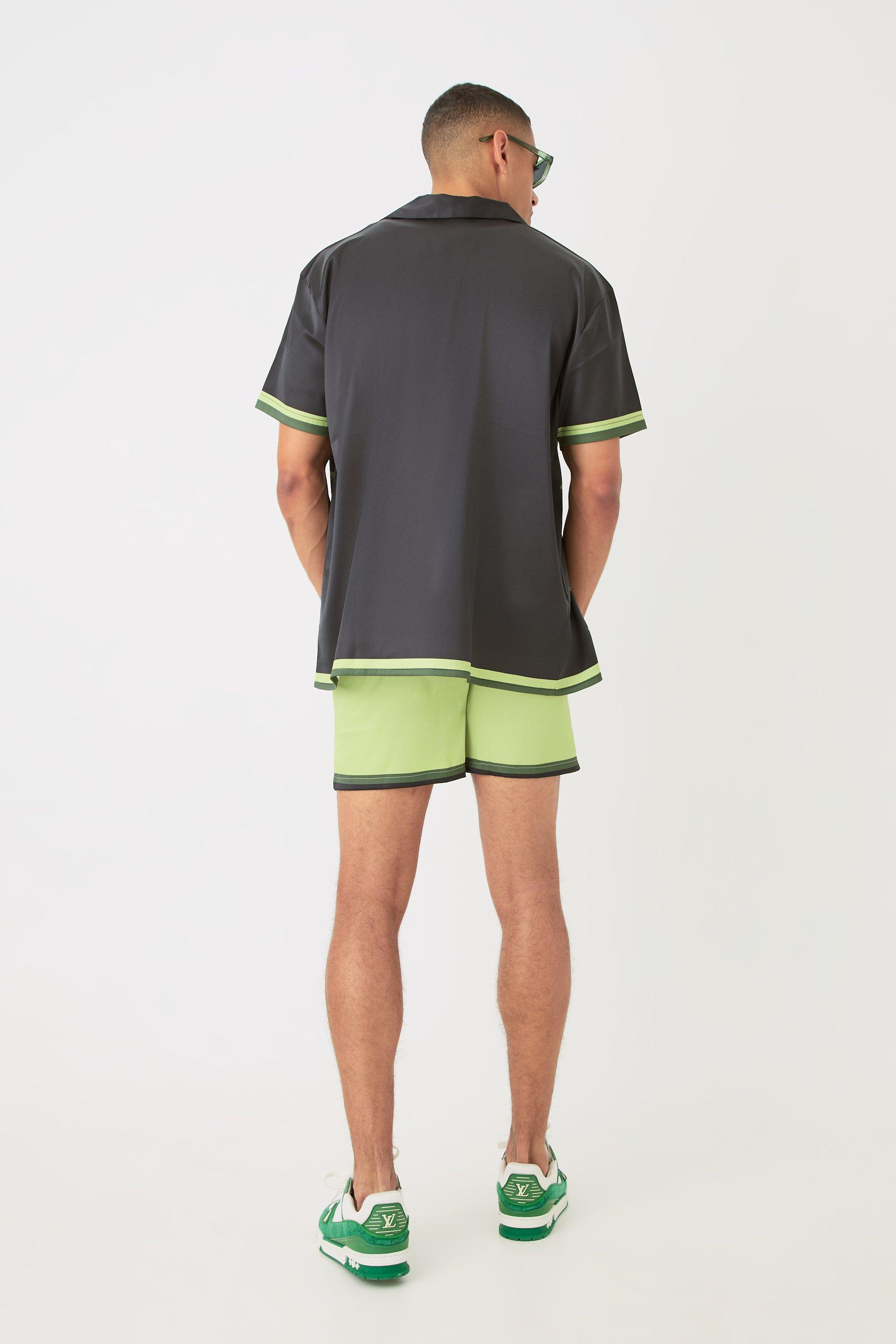Green shorts black shirt deals