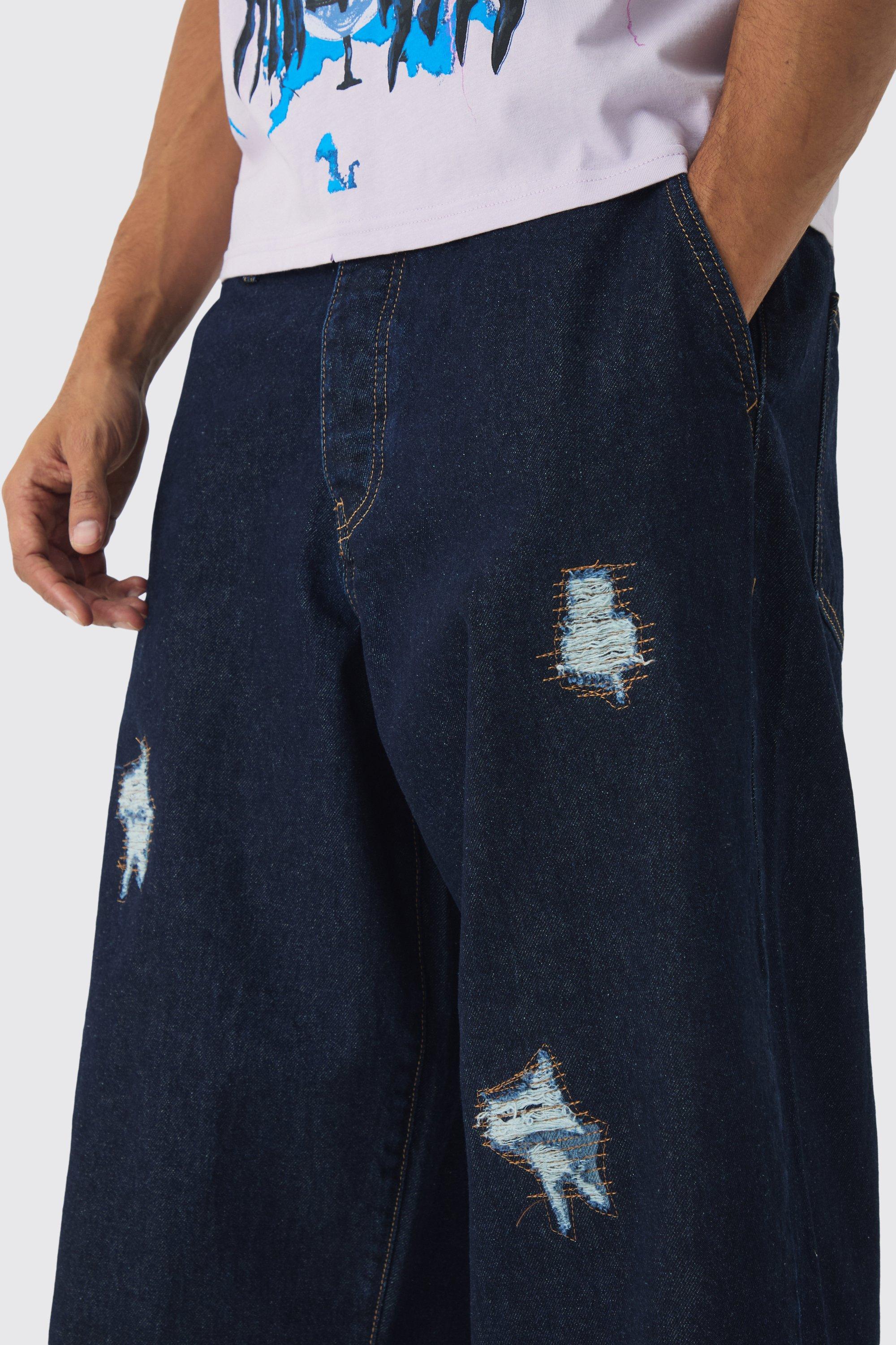Jeans indaco a palloncino in denim rigido con strappi