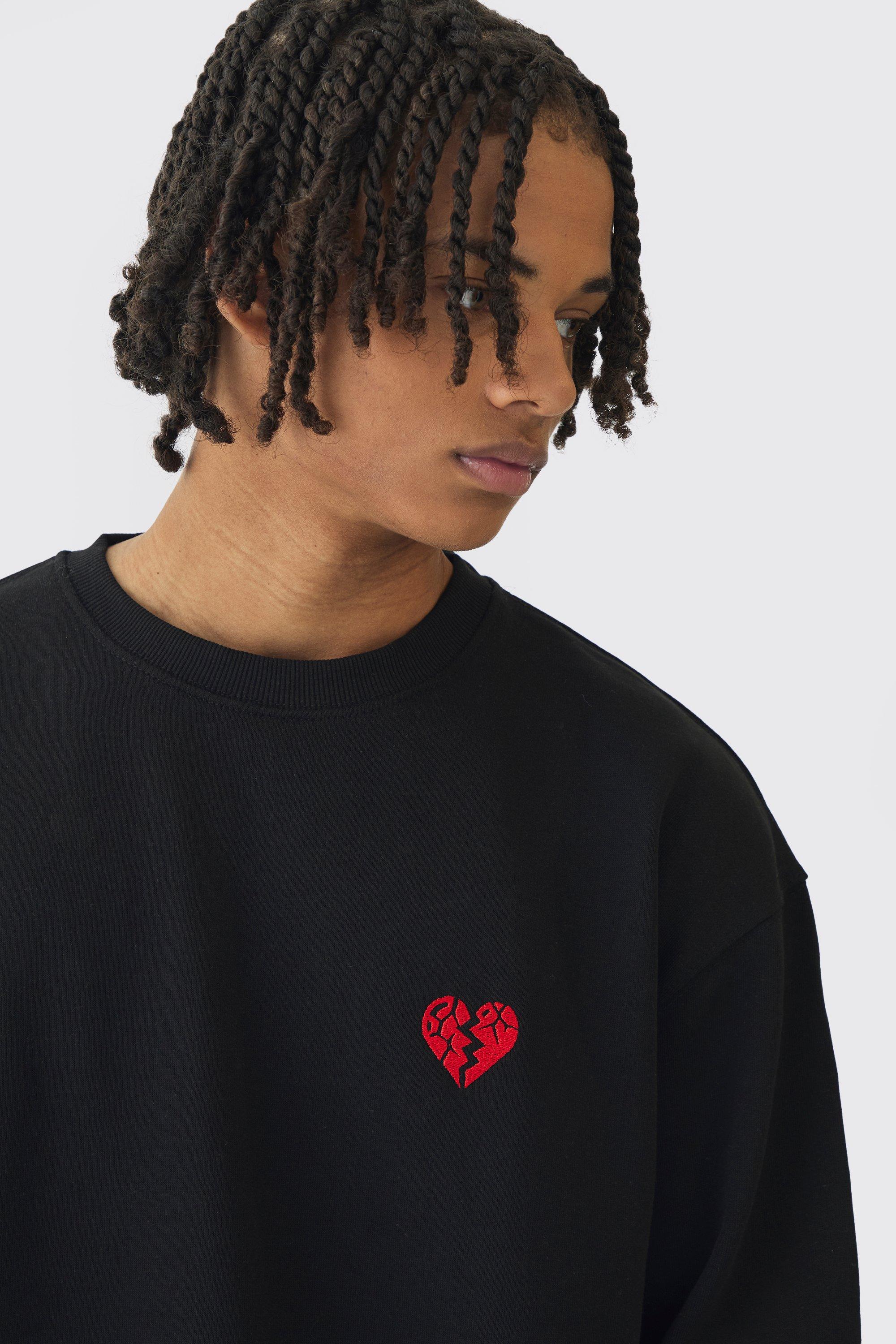 Felpa oversize con cuore spezzato