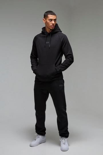 Man Active Regular Fit Badge Tracksuit black