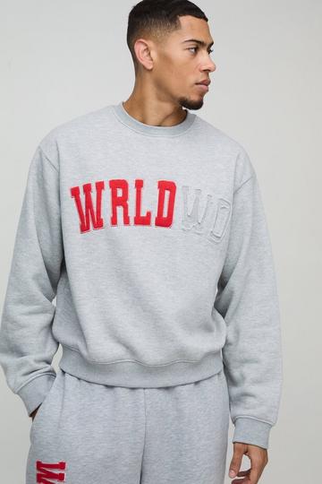 Oversized Boxy Worldwide Distressed Applique Sweatshirt grey marl