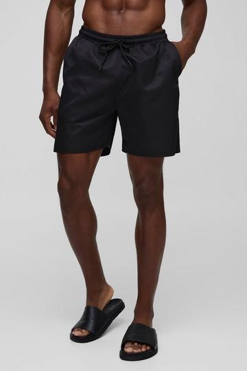 Black Mid Length Swim Short in Black