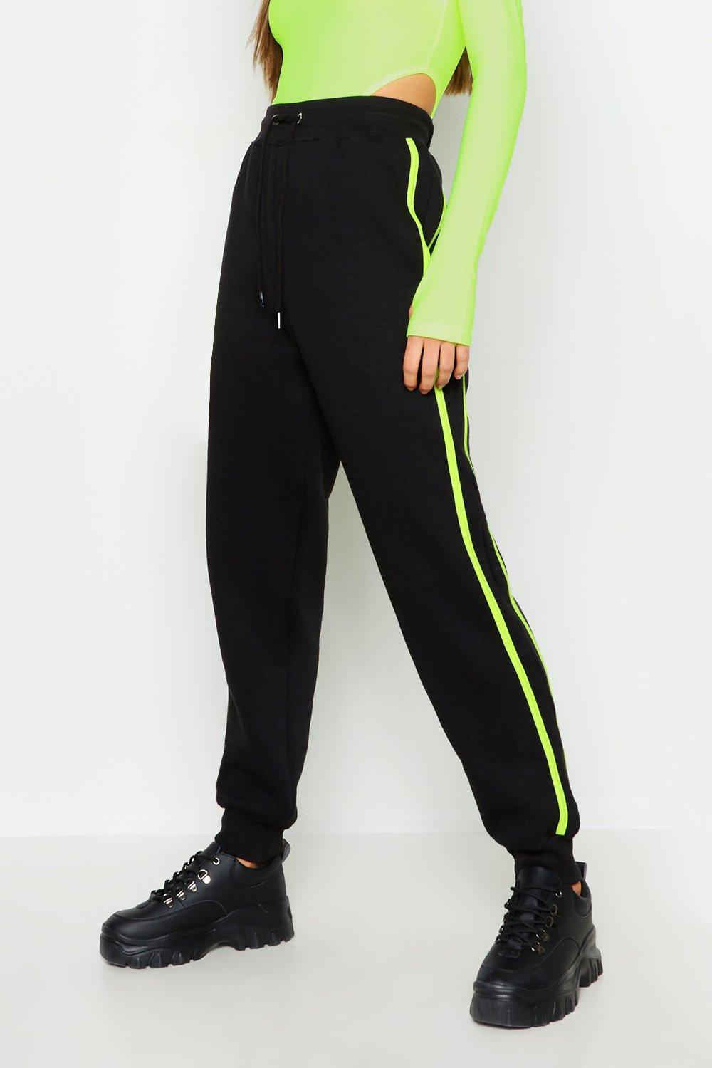 Black joggers with cheap neon stripe