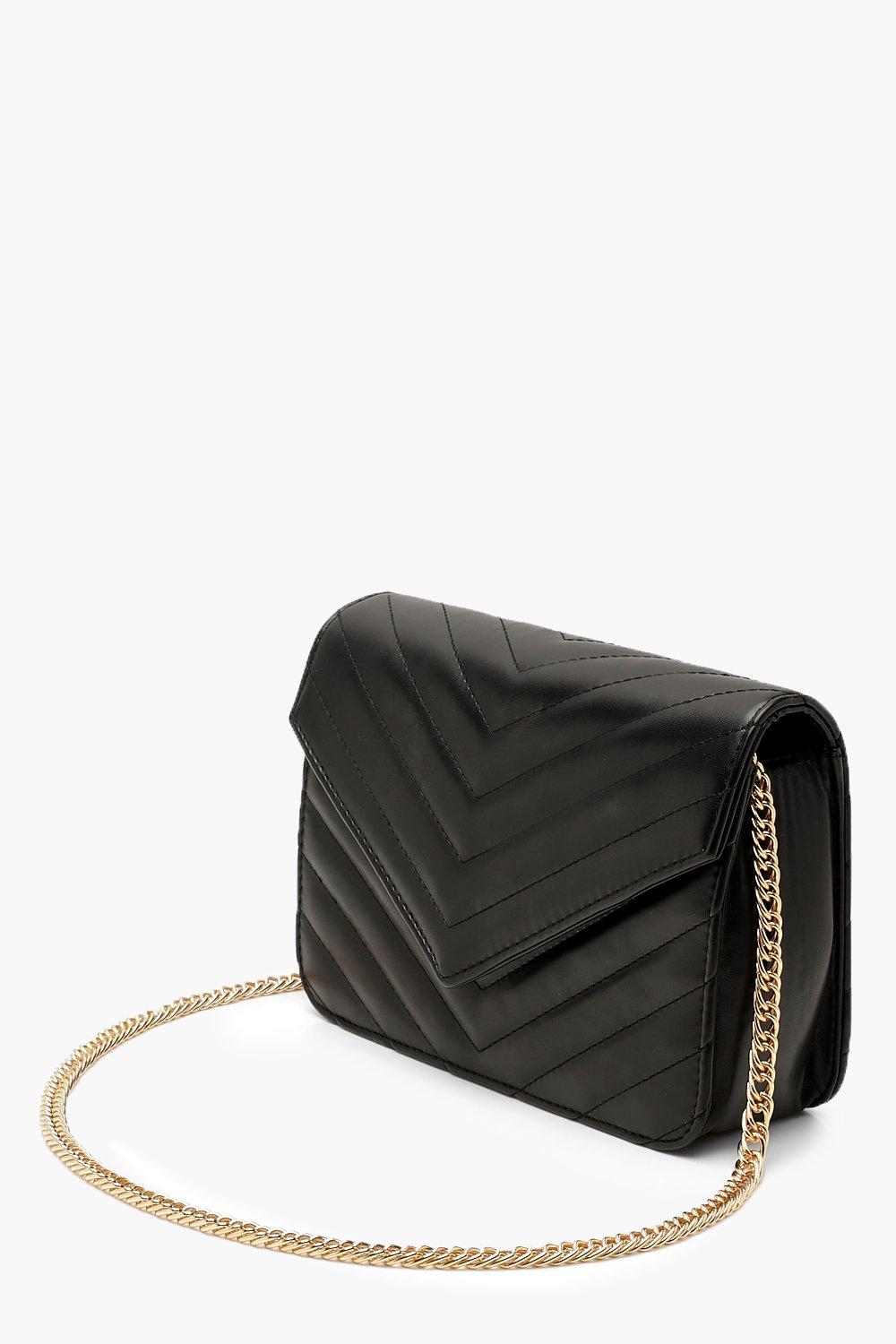 Black quilted cross body bag in 2023