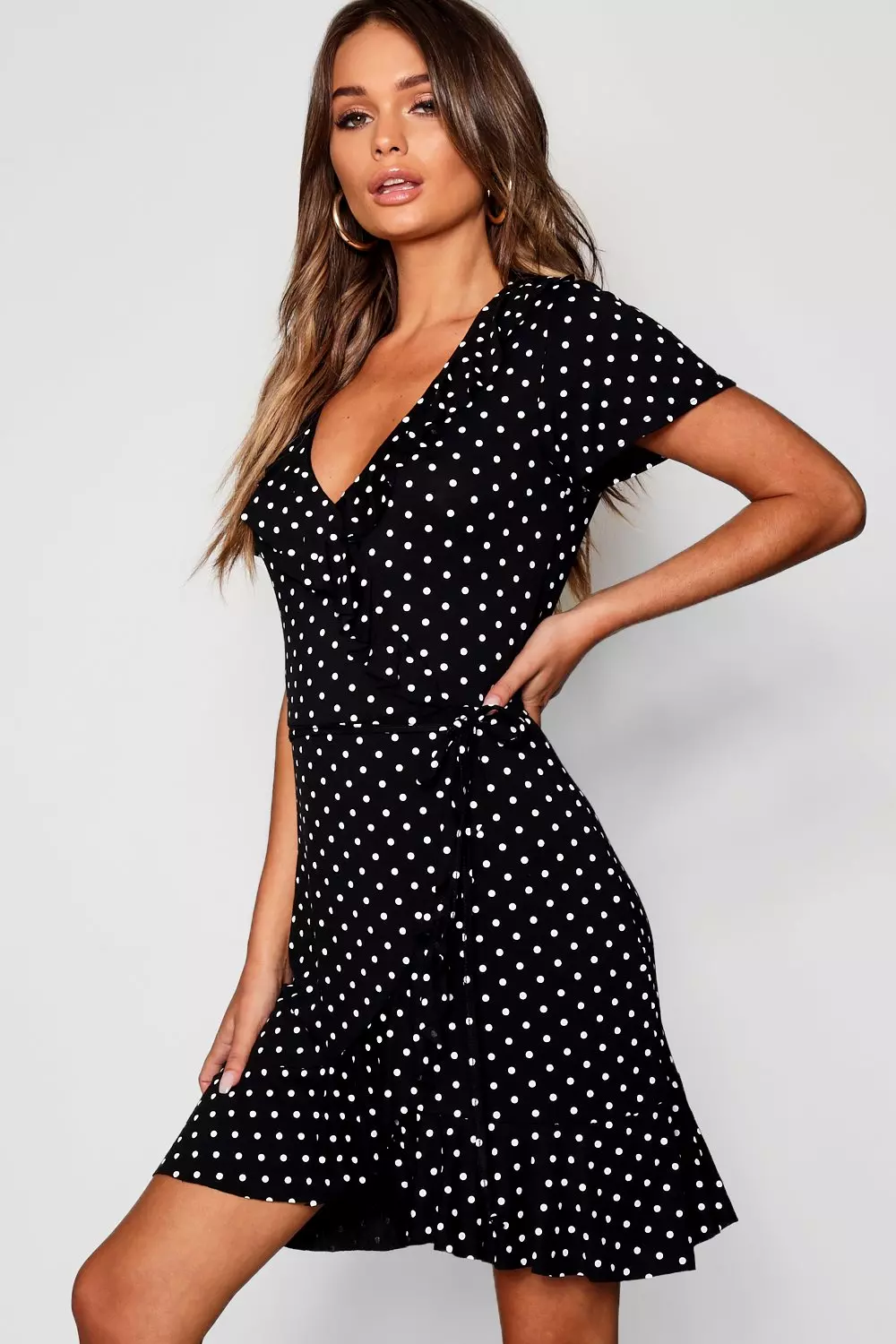 Black polka dot store wrap dress