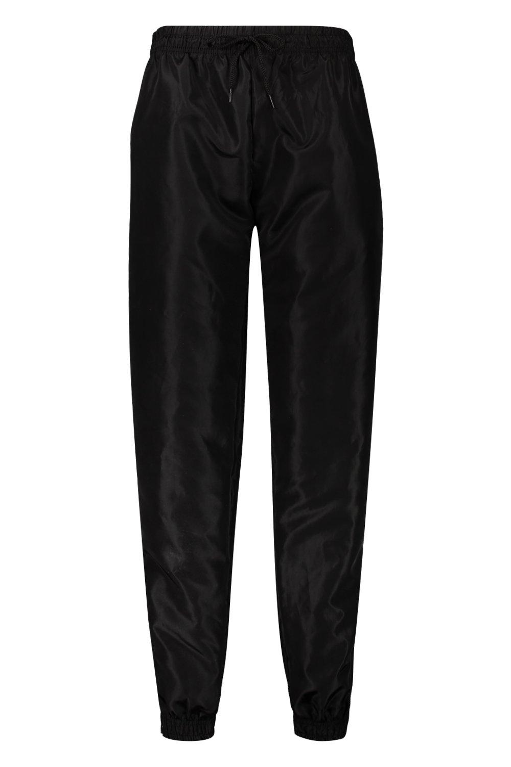 Black shell suit joggers on sale