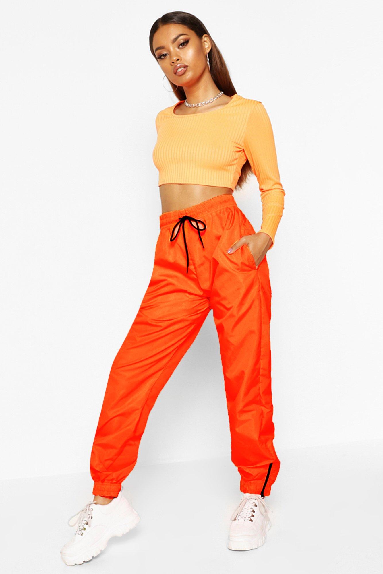 neon orange track pants