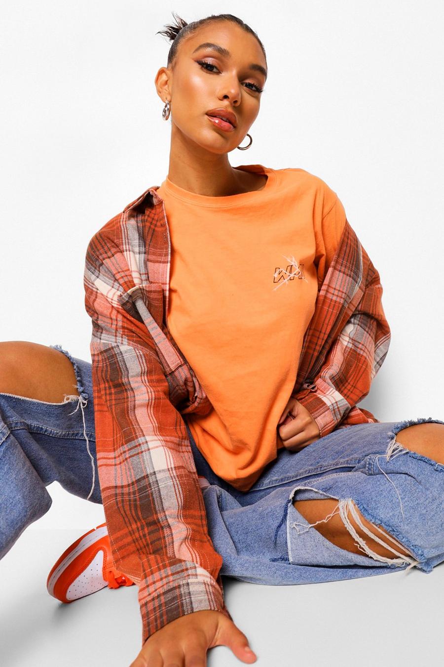 Orange Woman T-shirt med tryck och blixt image number 1