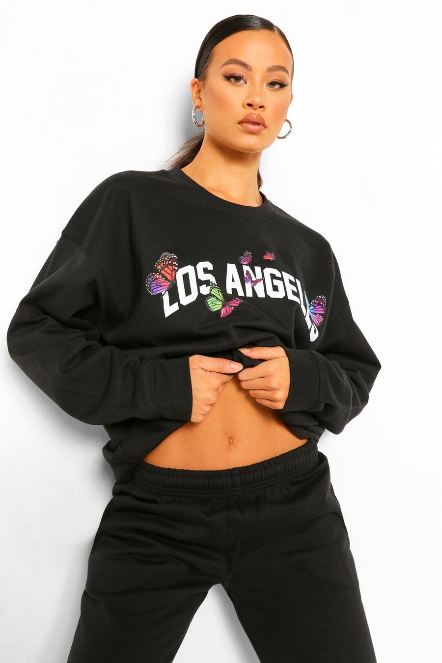 "Los Angeles" Oversize sweatshirt med fjärilar image number 1