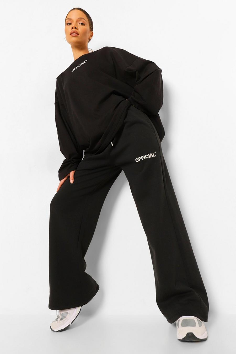Pantalón deportivo oversize de pernera ancha con eslogan, Negro image number 1