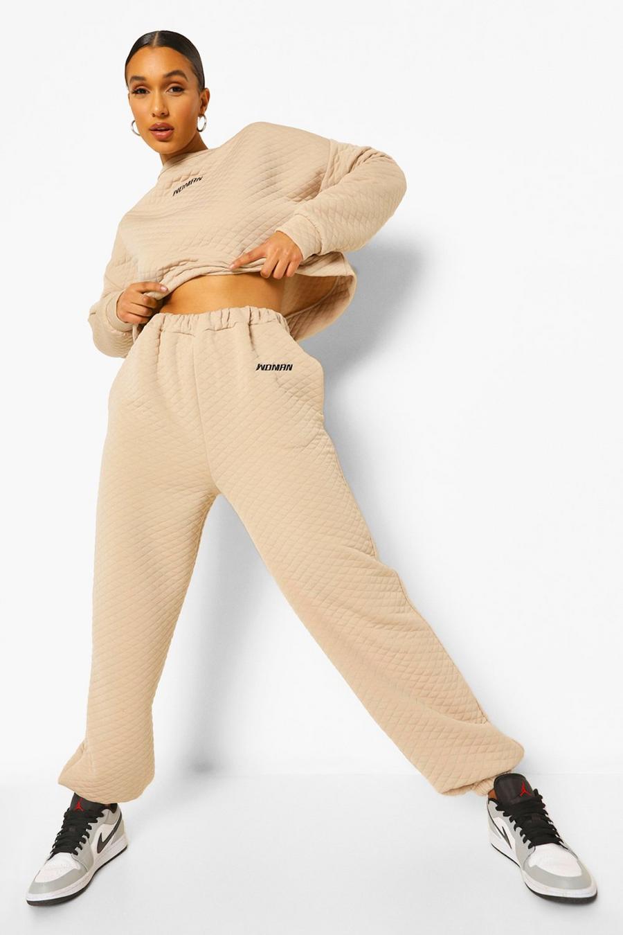 Pantaloni tuta oversize goffrati con ricamo Woman, Pietra image number 1