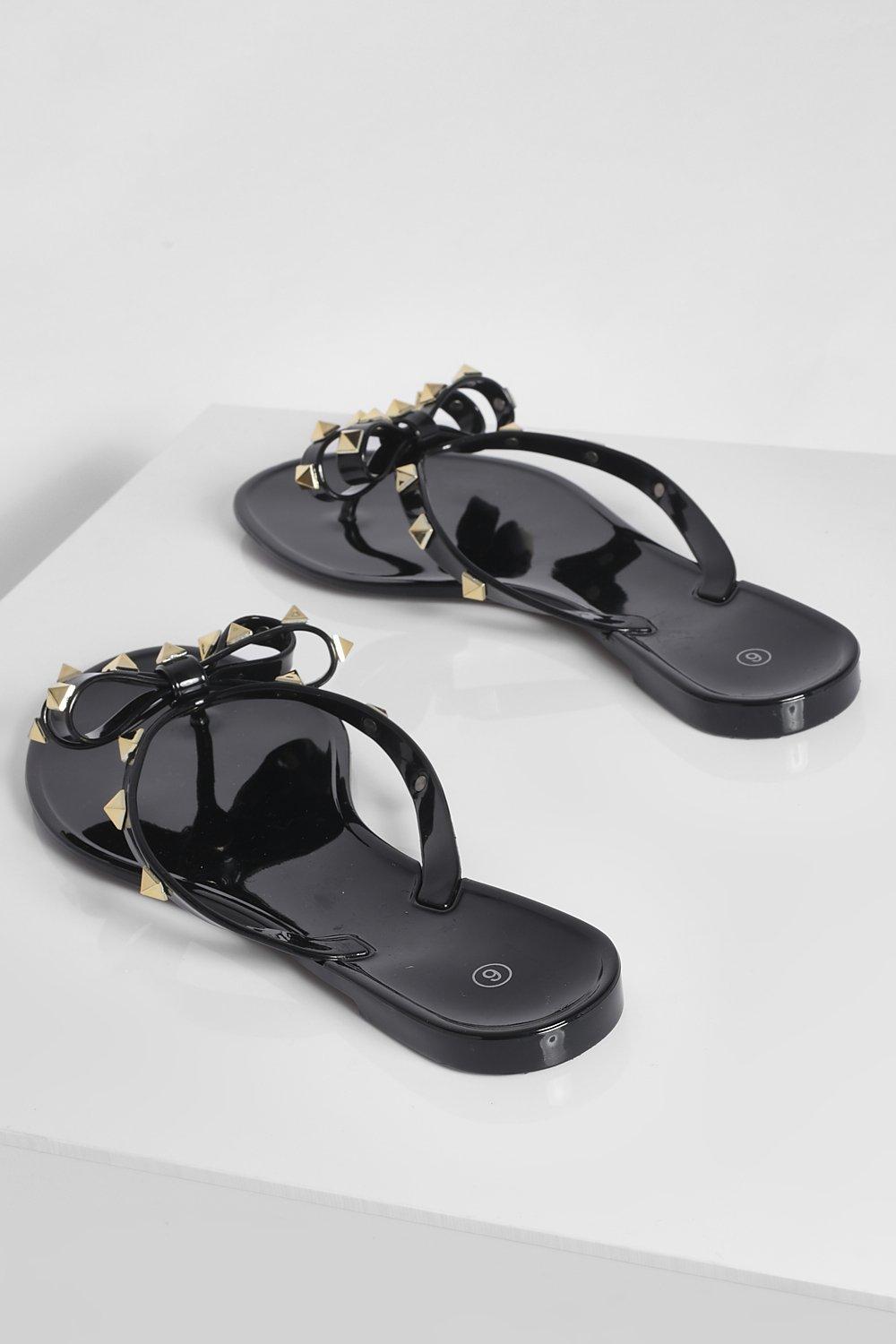 Black jelly flip store flops with bow