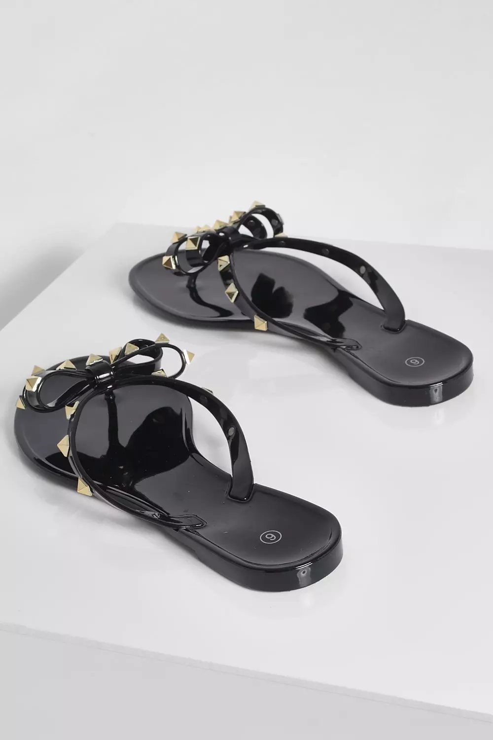 Black jelly flip store flops