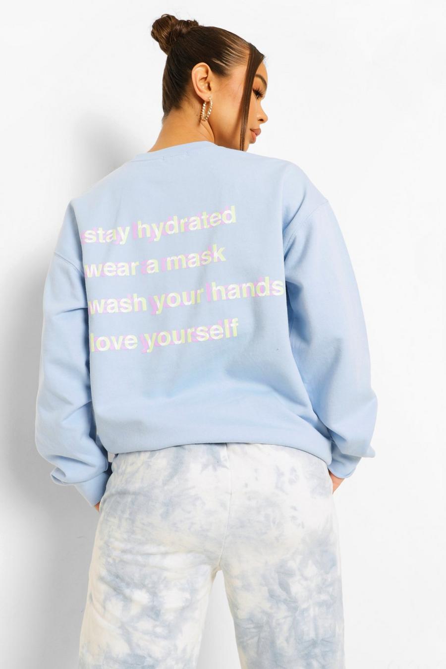 Pale blue "Self Care" Sweatshirt med tryck bak image number 1