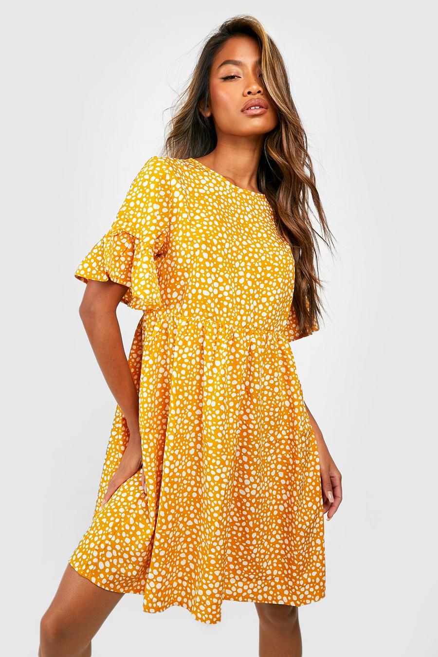 Mustard yellow Dalmatinprickig klänning med volanger