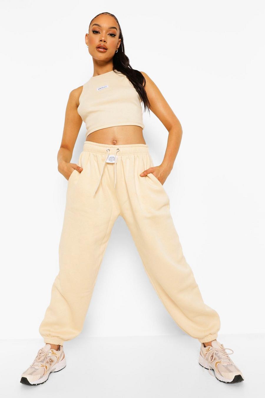 Pantaloni tuta con etichetta con scritta Woman, Pietra image number 1