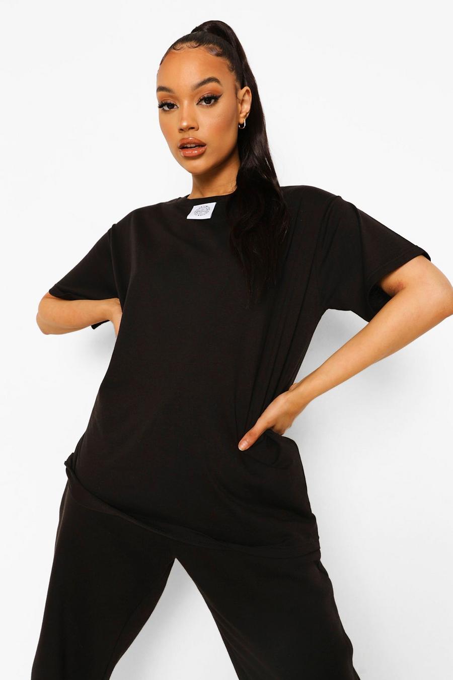 Übergroßes T-Shirt mit Woman-Etikett , Schwarz image number 1
