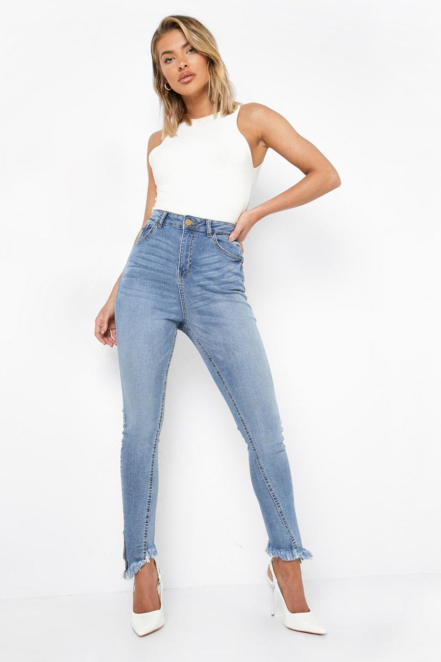 Mid blue Distressed Asymmetric Hem Skinny Jeans image number 1