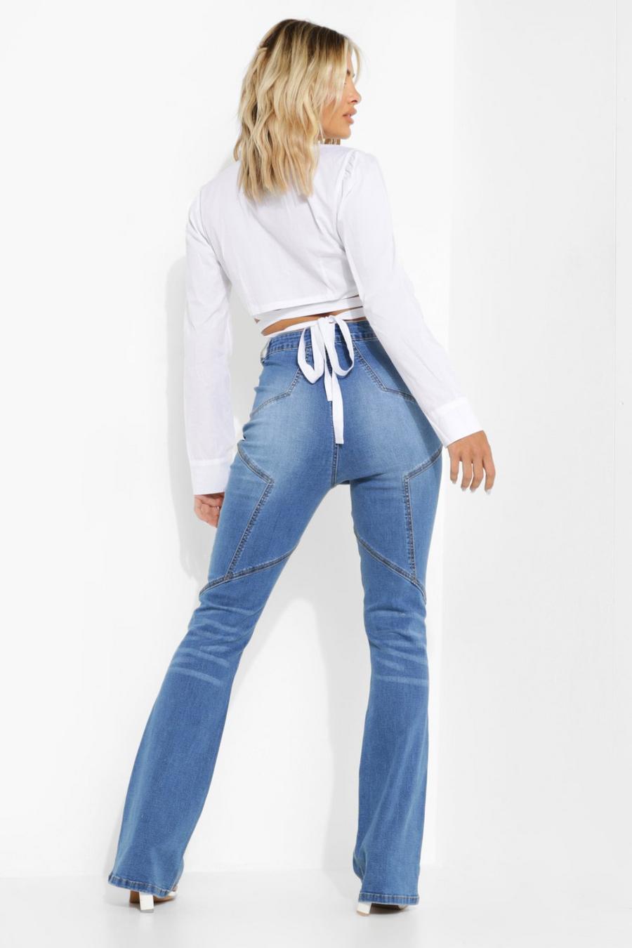 שפשוף בינוני מכנסי סקיני ג'ינס מתרחבים עם תפרים בצורת כוכב image number 1