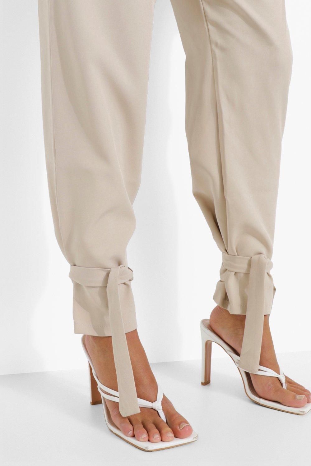 https://media.boohoo.com/i/boohoo/fzz18256_ivory_xl_3/female-ivory-tailored-tie-ankle-relaxed-fit-trousers