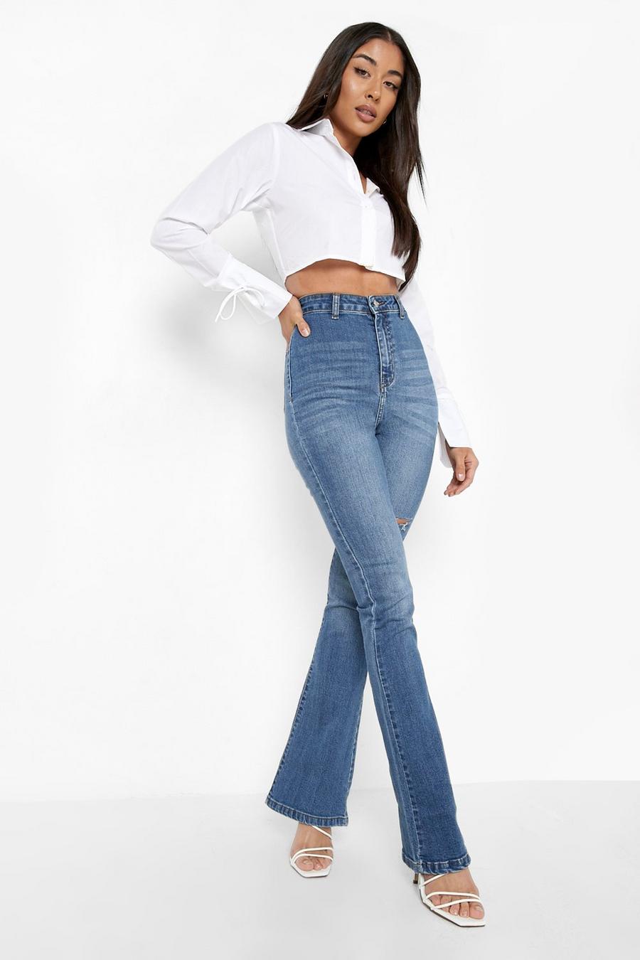 כחול ביניים סקיני ג'ינס high waist מתרחב עם קרע באזור הירך image number 1