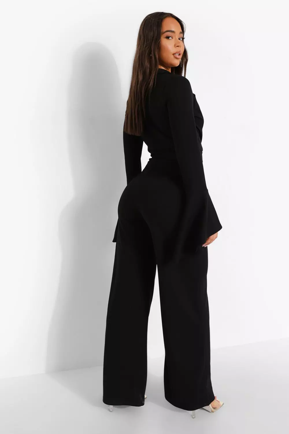 Irregular flared sleeve knot side wide leg clearance jumpsuit