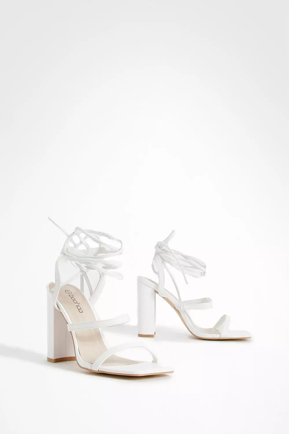 Lace up store block heels white