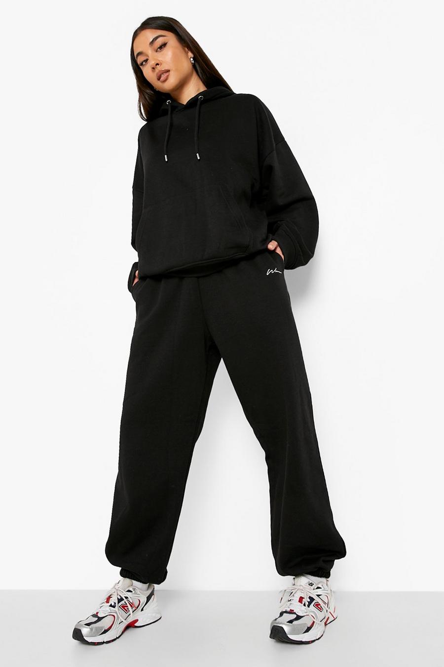שחור nero מכנסי ריצה אוברסייז מבד ממוחזר עם כיתוב Woman