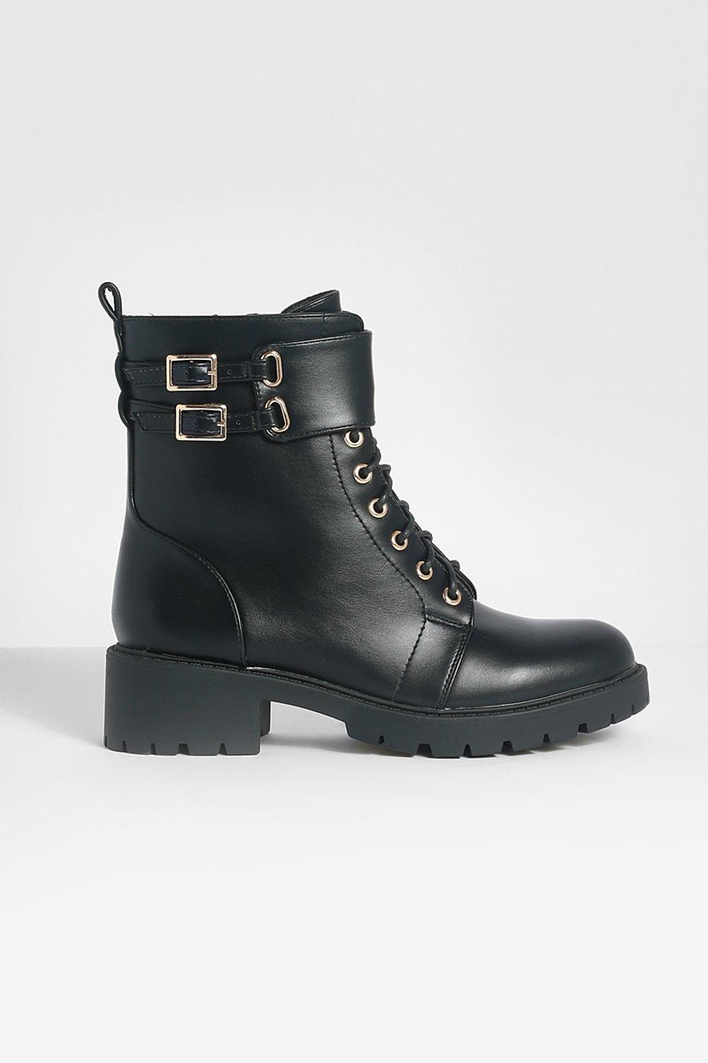 Black combat boots store with gold buckles