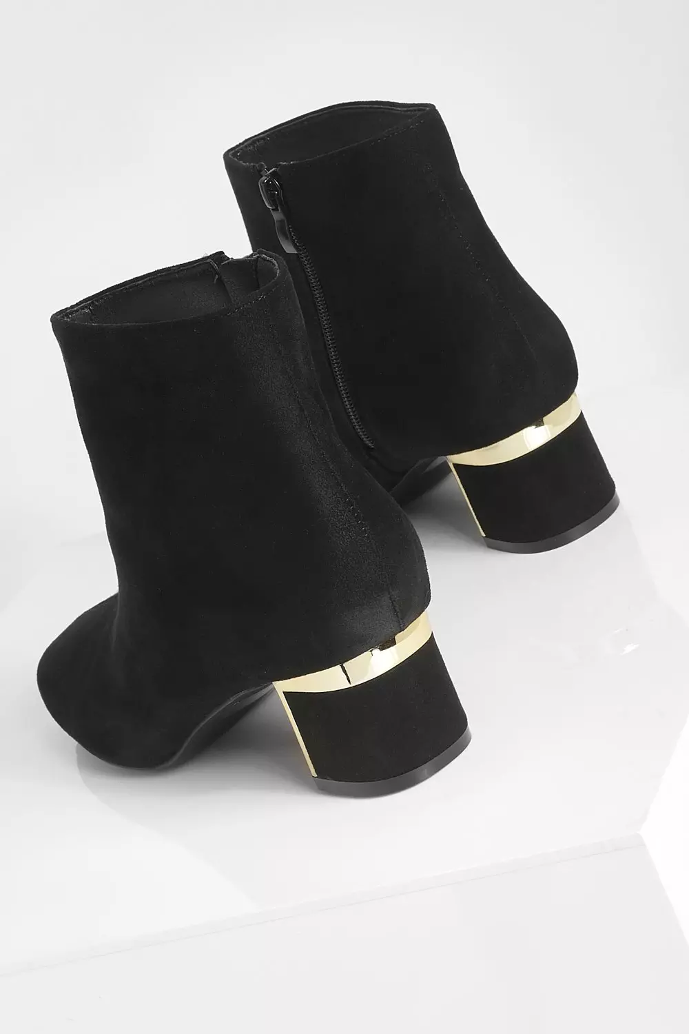 Black ankle boots with metal clearance detail