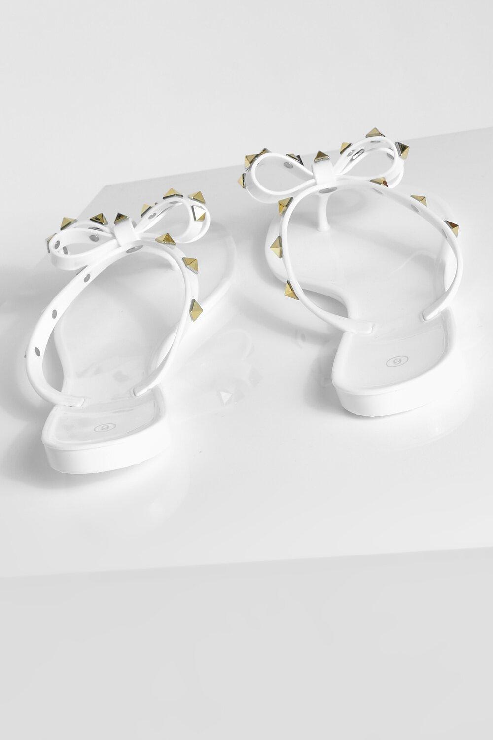 White jelly flip store flops