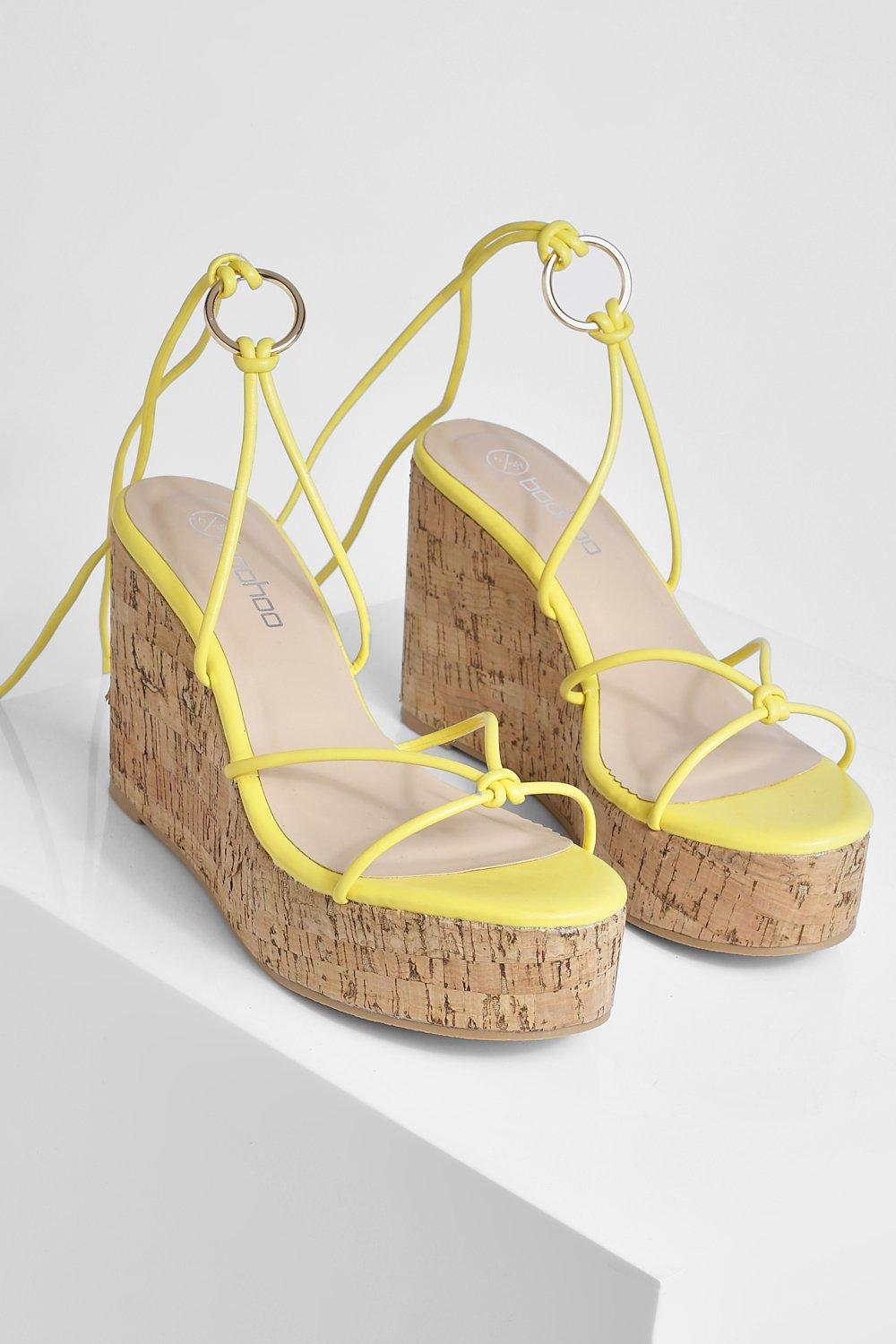 Yellow lace up store wedges