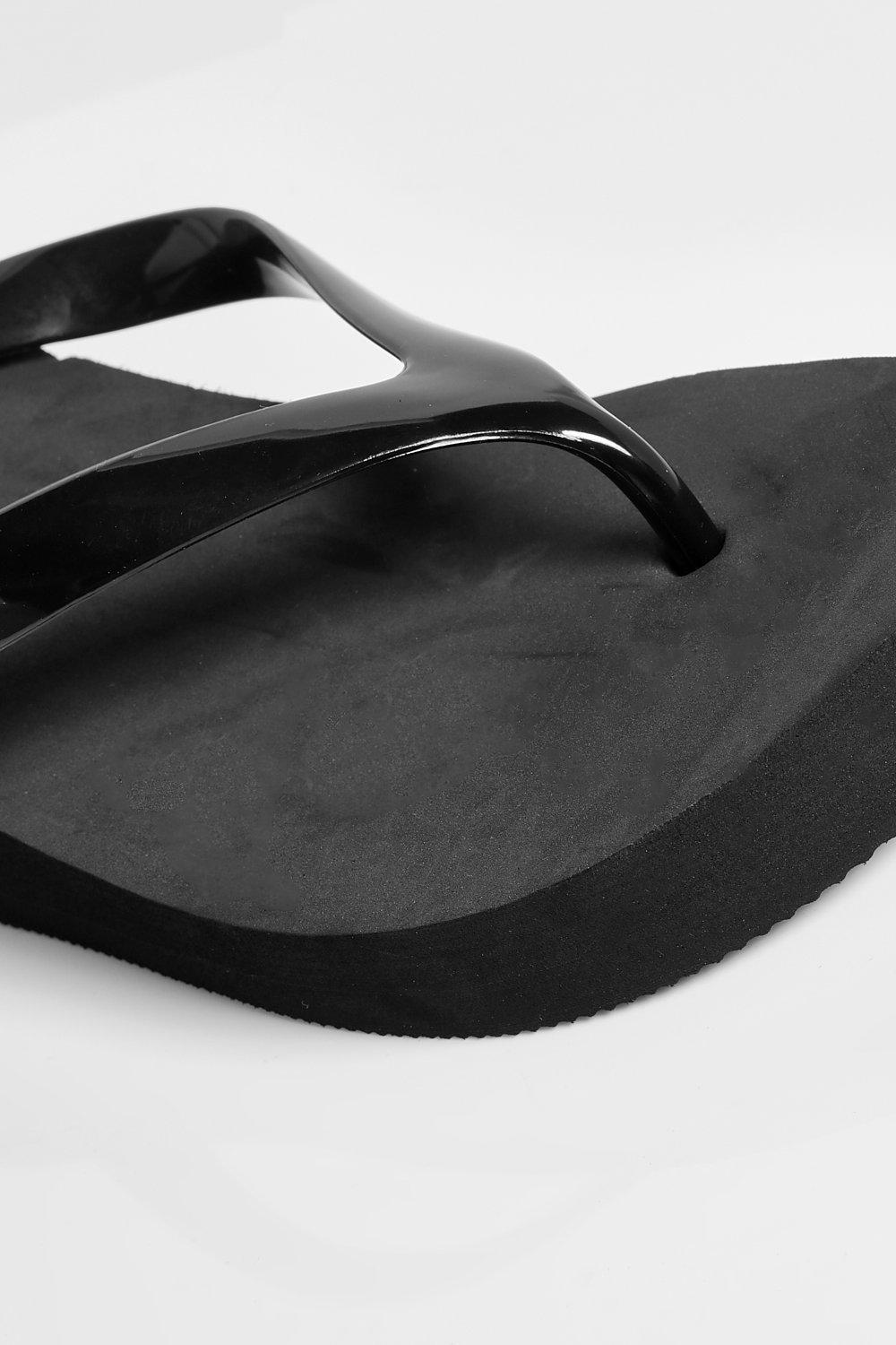 black wedge flip flops