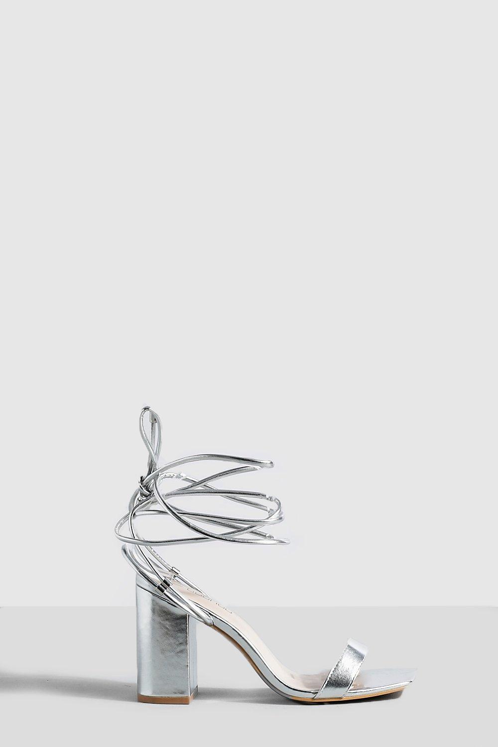 Silver heels that store wrap around leg