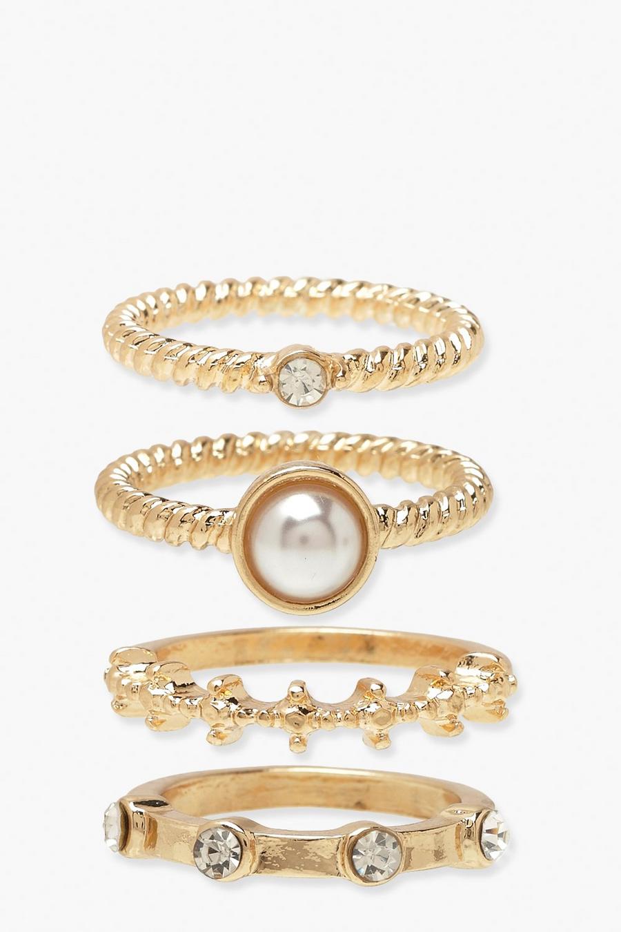 Gold metallic 4 Pack Pearl and Diamante Stacking Rings image number 1